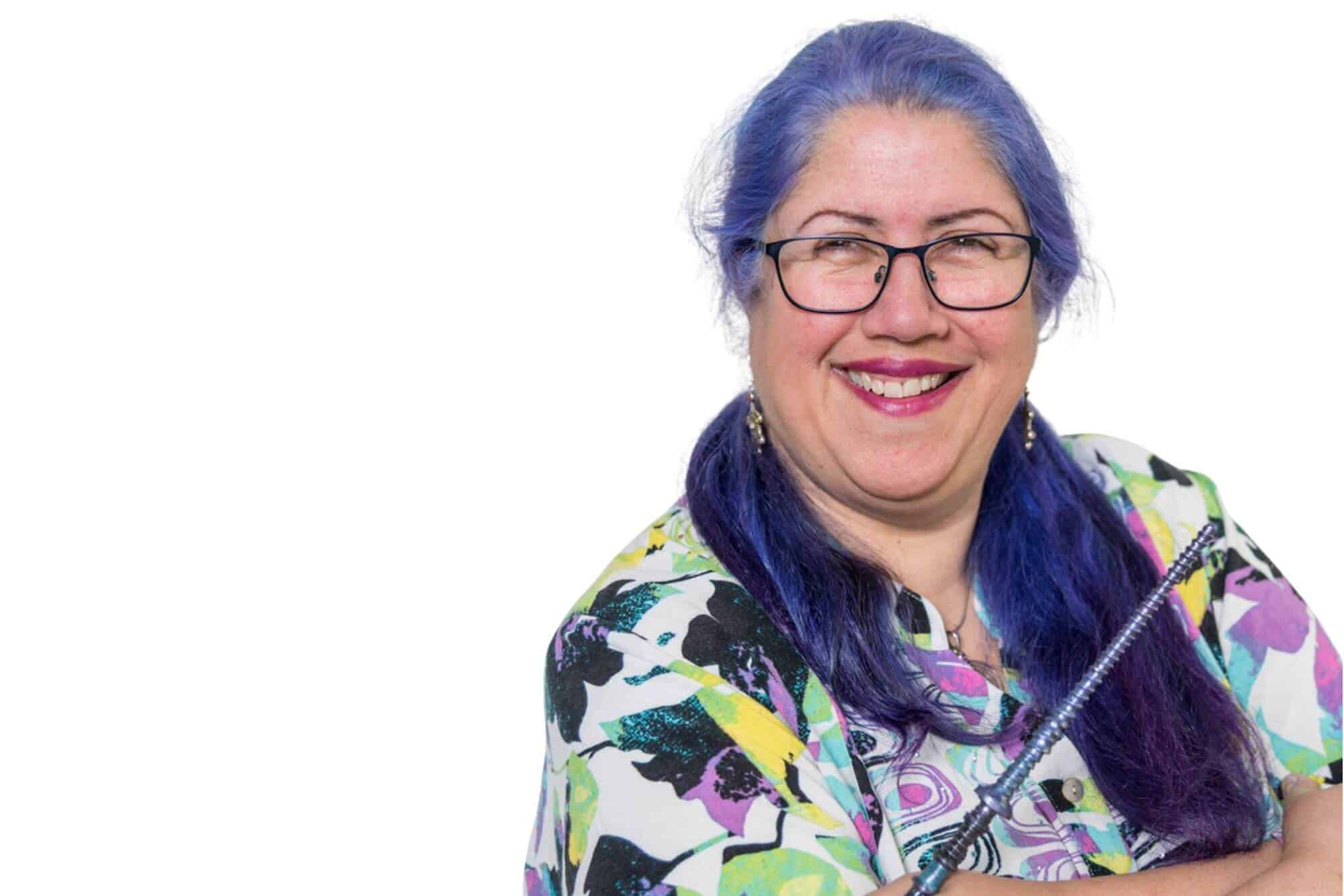 Karen Leslie arms crossed with wand